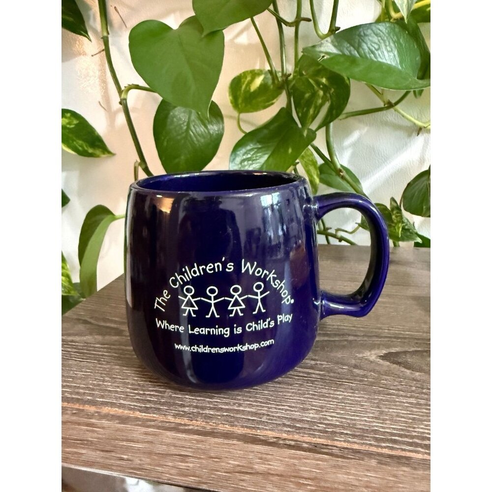 The children’s workshop blue mug